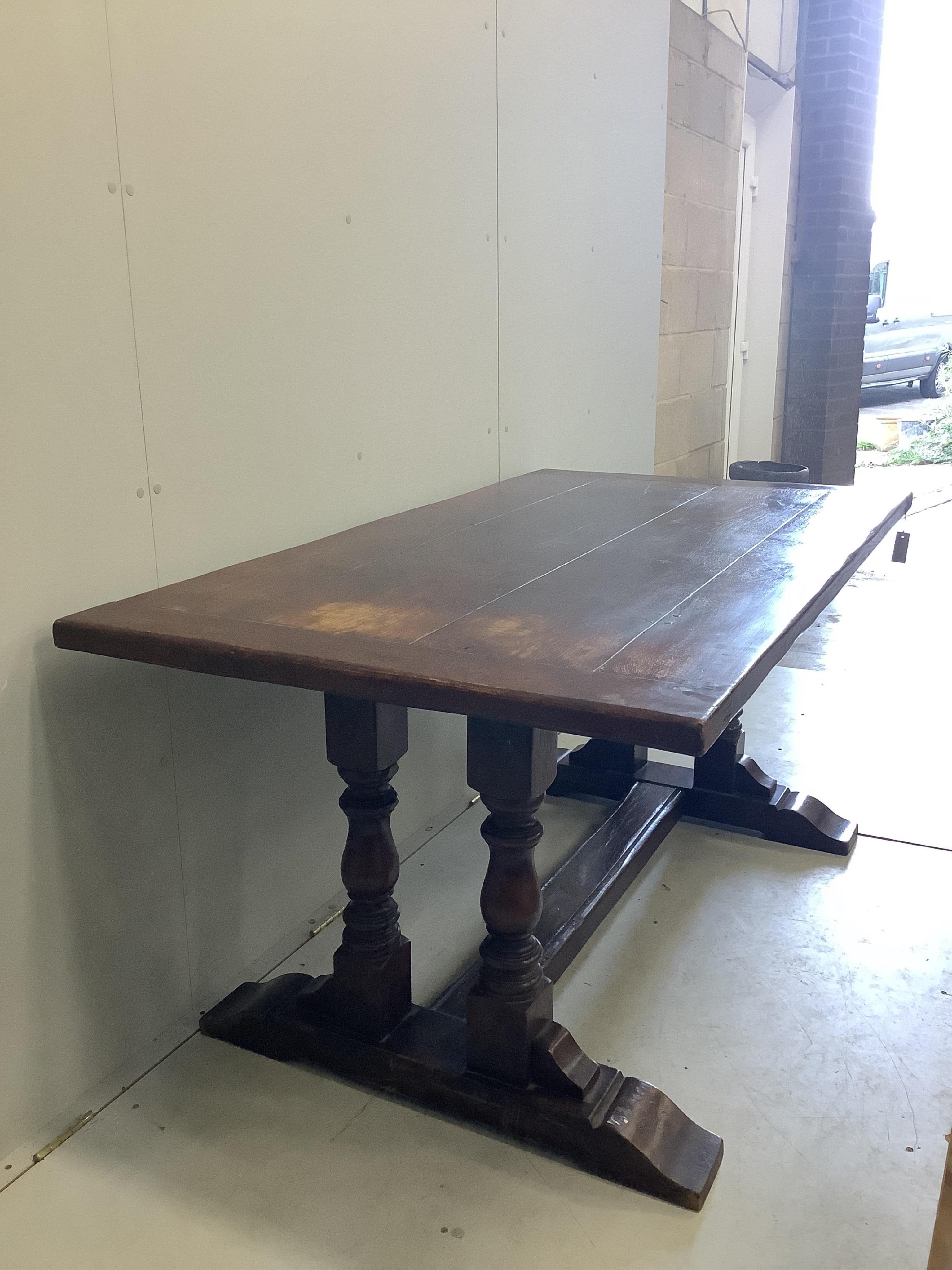 An 18th century style rectangular oak refectory dining table, width 167cm, depth 91cm, height 77cm. Condition - fair, top faded in several places